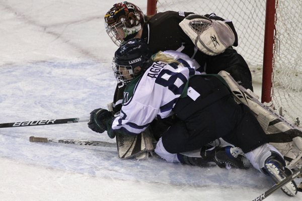 Photo by Ethan Magoc/The Merciad: Mercyhurst College's Meghan Agosta collides with Brown University goaltender Katie Jamieson during the first period on Friday, Jan. 14, 2011 at Tullio Arena.